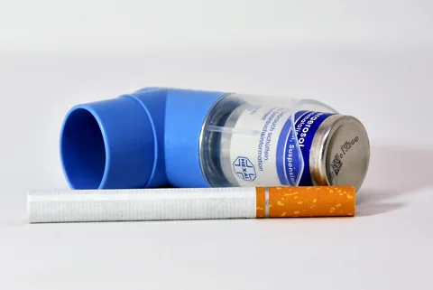 A child using an asthma inhaler