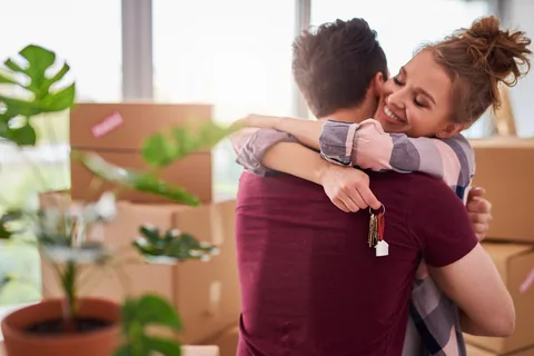 A couple holding keys to a new home