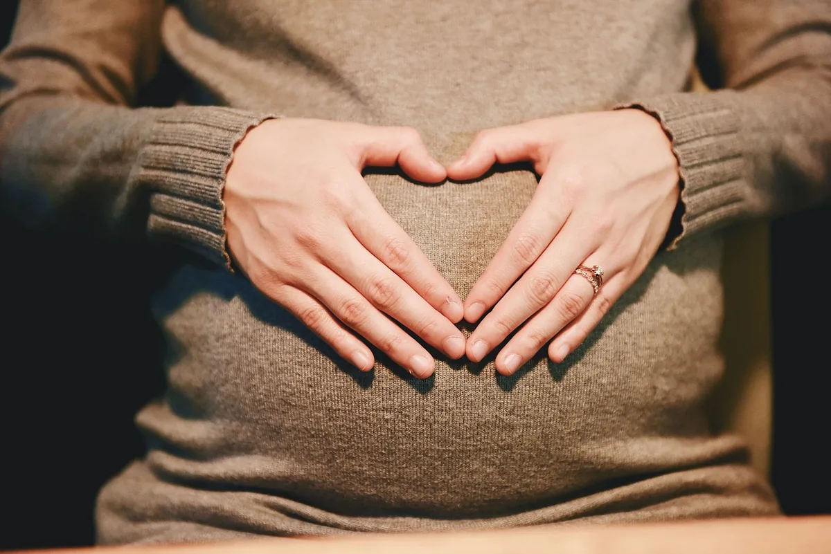 A pregnant woman relaxed at home