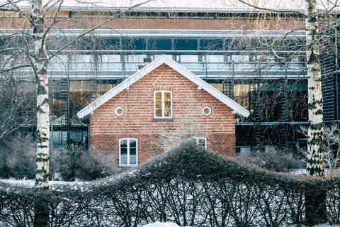 A snow-covered house exterior in winter