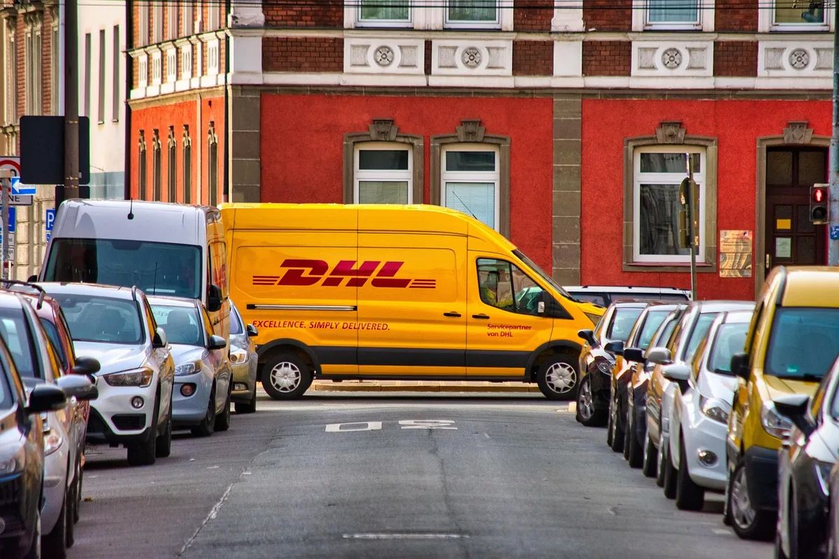 A pest control service van parked on a street